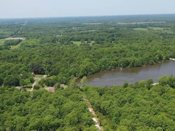 SOLD- 0.26 Acres Treed Land to Build or Invest near Lakes